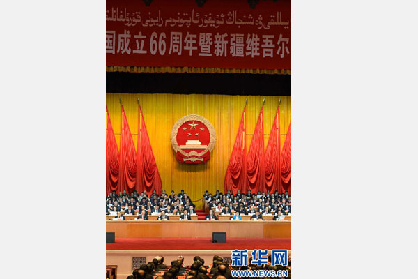 10月1日，慶祝中華人民共和國成立66周年暨新疆維吾爾自治區(qū)成立60周年大會在新疆人民會堂隆重舉行。 新華社記者 高潔 攝 