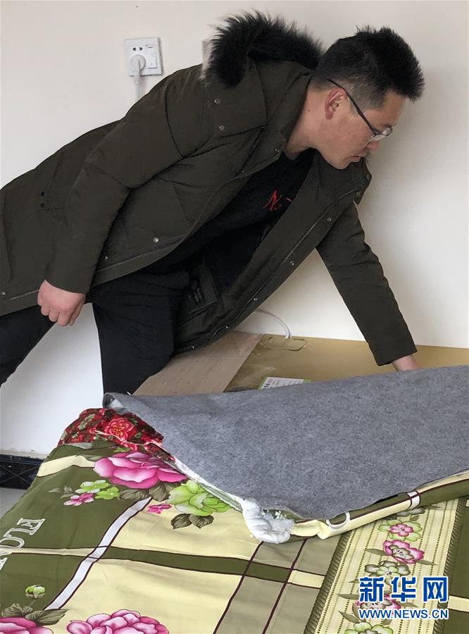 (新春走基層·圖文互動)(3)班彥村“冬天最幸福的事”:用上“電熱炕” 告別煤煙味