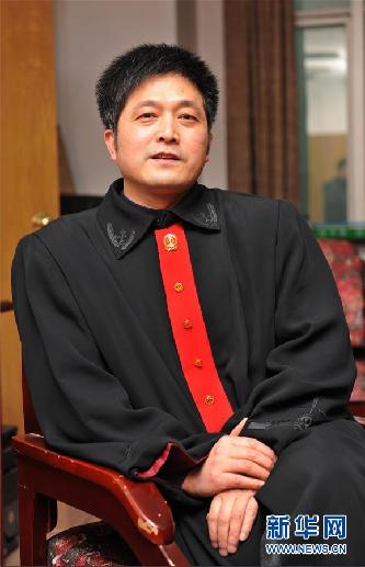 (圖文互動)其人如蘭,既潔且馨——追記“全國模范法官”胡國運(yùn)